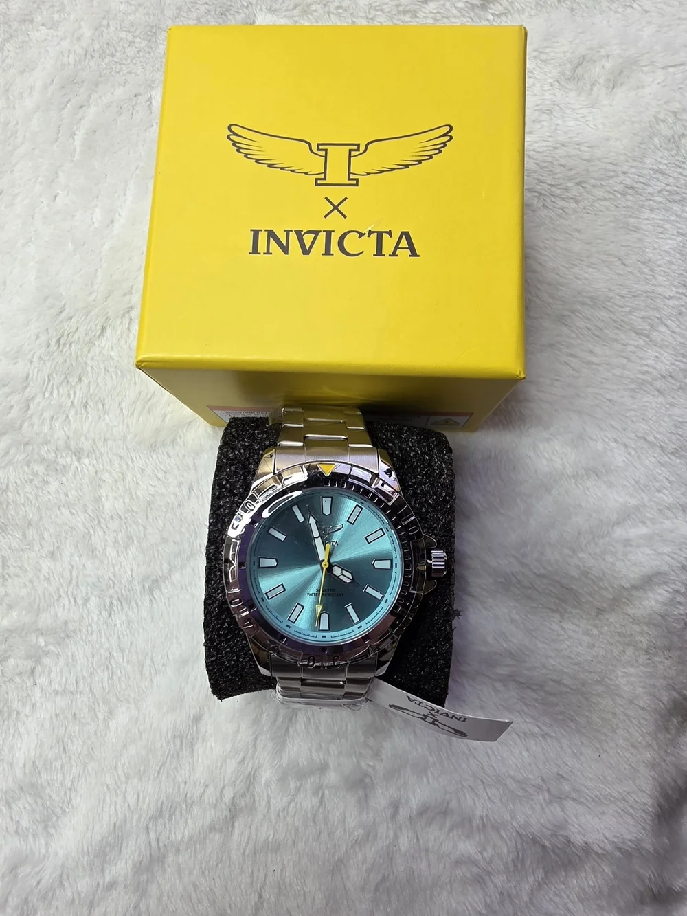 Invicta Men’s Silver Watch with Teal Dial and Yellow Accent 70051